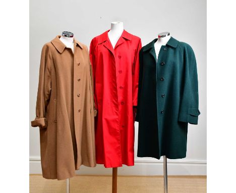 BURBERRY; three vintage lady's coats to include a red cotton blend trenchcoat with checked lining, size 18, a brown 100% wool