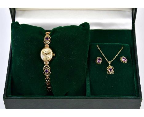 SOVEREIGN; a suite of 9ct yellow gold and amethyst jewellery comprising pendant on chain, pair of ear studs and wristwatch, i