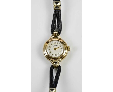 BAUME; a lady's vintage 9ct yellow gold wristwatch with Arabic numerals to the dial.