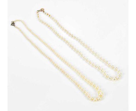 Two strings of graduated vintage cultured pearls.