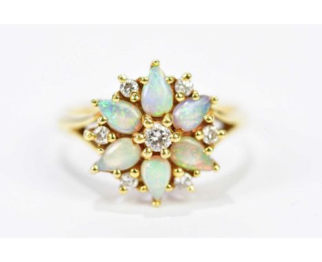 An 18ct yellow gold diamond and opal floral cluster ring, size O, approx. 4.57g.Condition Report: 2mm fine hairline to one of