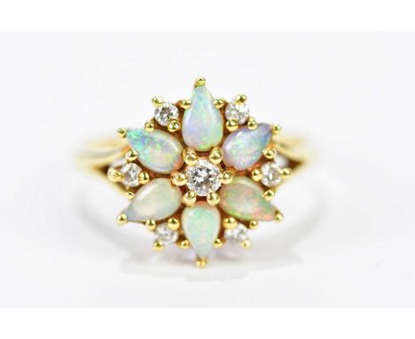 An 18ct yellow gold diamond and opal floral cluster ring, size O, approx. 4.57g.Condition Report: 2mm fine hairline to one of