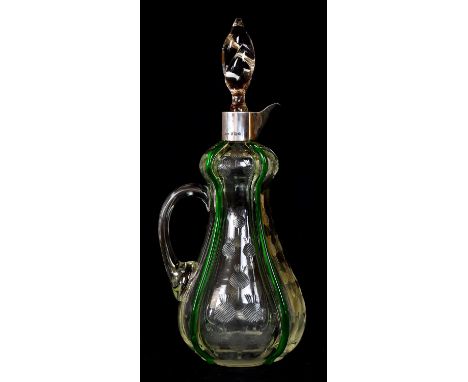 ATTRIBUTED TO STUART &amp; STUART; an Art Nouveau clear glass claret jug with trailed green glass detail and engraved thistle