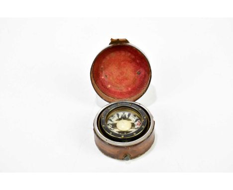 An early 20th century leather cased compass, with applied silvered metal plaque inscribed 'To RCS as dues for pilotage servic
