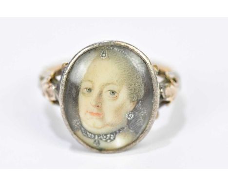 An 18th century yellow metal mourning ring with portrait of a woman to the oval platform, unmarked, size I 1/2, approx. 3.93g