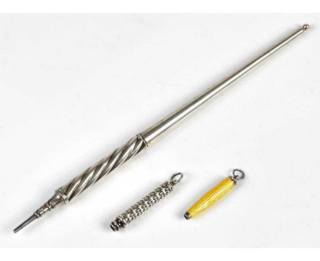 SAMPSON MORDAN; a white metal pencil of tapering form with wrythen grip, length 19cm, a miniature yellow enamel propelling pe