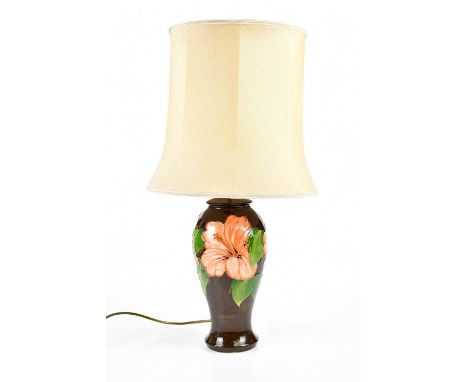 MOORCROFT, a 'Hibiscus' pattern table lamp, with a shade, lamp height 32cm.