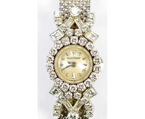 JAEGER-LECOULTRE; a lady's vintage 18ct white gold diamond set cocktail watch with signed circular dial set within a framewor