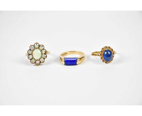 A 9ct yellow gold opal flower head ring, size L, and two 9ct yellow gold lapis lazuli set rings, combined approx 10.65g (3).C