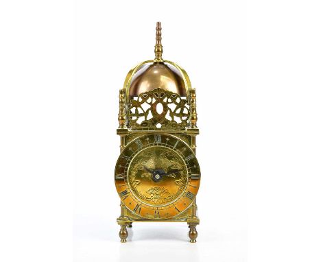 BUTT &amp; CO; a brass mantel timepiece modelled as a lantern clock, height 28.5cm.