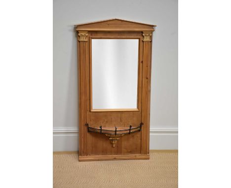 A modern pine wall mirror of architectural form with demi lune shelf, height 120cm, width 62cm.