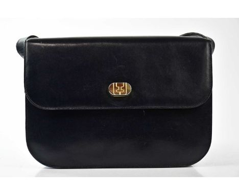 SALVATORE FERRAGAMO; a navy blue vintage leather shoulder bag with flap front, gold tone hardware magnetic lock to front with