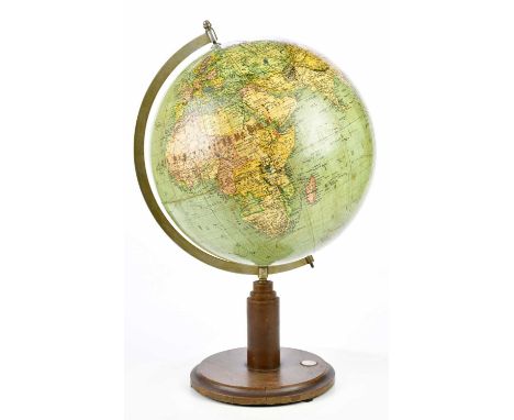 An early 20th century desk globe with compass to the stand, height 56cm.
