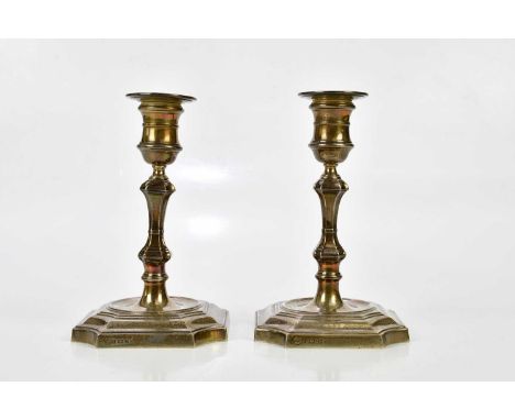 BARKER ELLIS COMPANY; Elizabeth II hallmarked silver candlesticks with square plinth bases, Birmingham 1965, height 17cm, (we