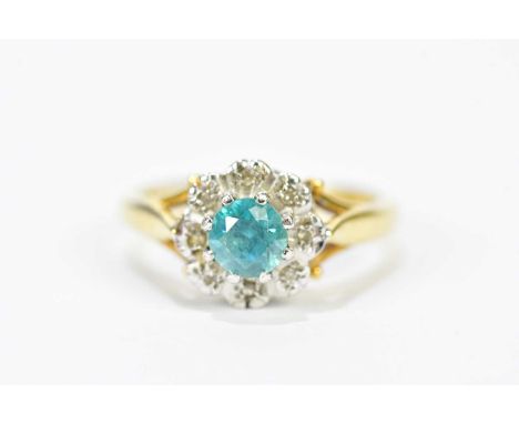An 18ct yellow gold topaz and diamond floral cluster ring, size K, approx. 4.62g.
