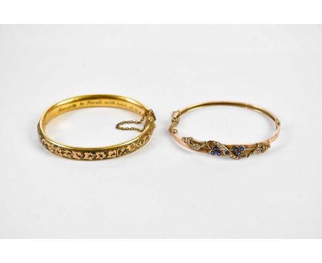 A 9ct yellow gold pearl set oval hinged snap bangle (5.3g), and a yellow metal bangle (2) 
