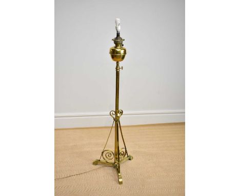 An early 20th century brass telescopic oil lamp, converted, height 140cm.