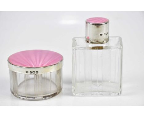 Two hallmarked silver and pink enamel topped glass toilet jars, Birmingham 1936, tallest 8cm (2)Condition Report: Smaller jar