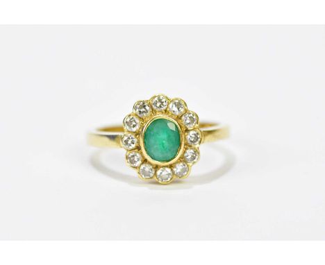 An 18ct yellow gold diamond and emerald flowerhead ring, size M, approx. 3.6g.