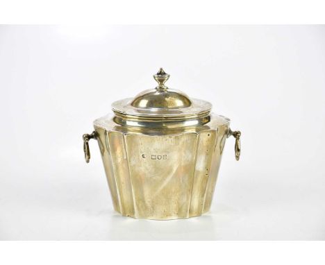 WILLIAM HUTTON &amp; SONS; an Edward VII hallmarked silver tea caddy of oval form with panel decoration and two loop handles,