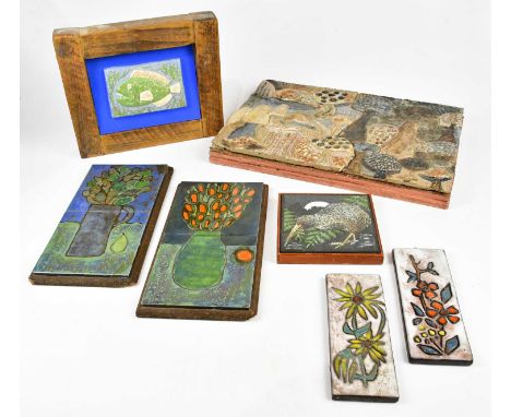 † A contemporary studio pottery wall plaque, relief decorated with fairy rings and stylised garden scene, 32 x 46cm, two West