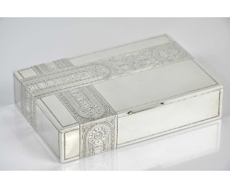 ALEXEI KORZININ (probably); a Russian silver cigar box, with chased decoration and text and Russian Empire crest, gilt interi