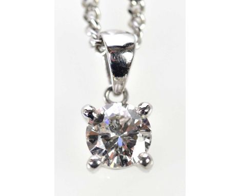 An 18ct white gold diamond pendant, the four claw set round brilliant cut stone weighing approx. 0.60ct, suspended on a fine 
