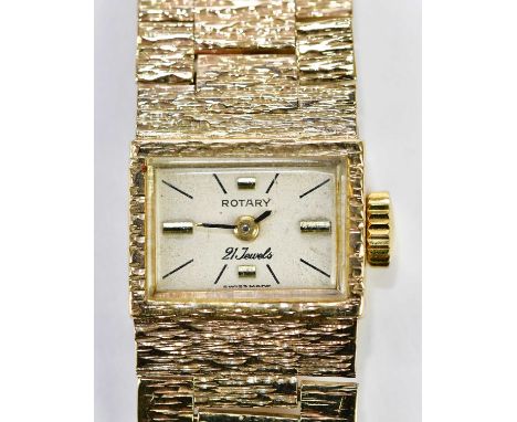 ROTARY; a 9ct yellow gold wristwatch with rectangular dial and gold textured bracelet, total approx. 27.4g.