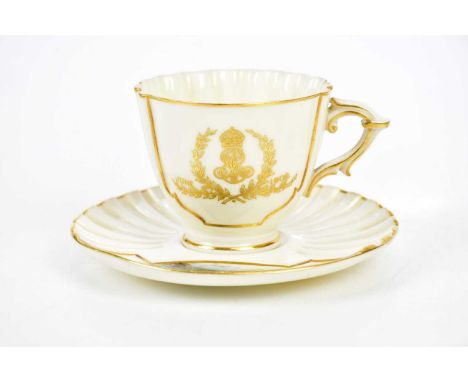 ROYAL WORCESTER; a teacup and saucer, the saucer with hand painted decoration of a castle.  Condition Report: Minor wear to t