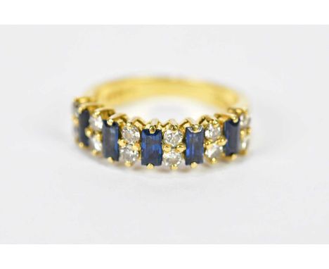 An 18ct yellow gold sapphire and diamond ring formed of five baguette cut sapphires and twelve round brilliant cut diamonds, 