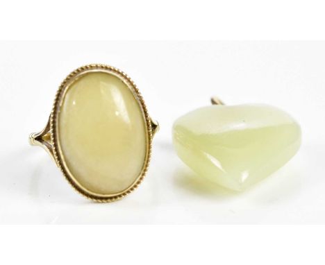 A 9ct gold and hardstone set dress ring (possibly Jade), size M 1/2, and a hardstone heart pendant (2). 