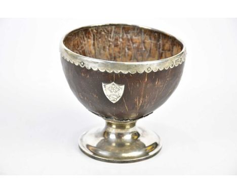 JAMES BERRY; a Victorian hallmarked silver mounted coconut bowl with hallmarked silver rims and foot, with white metal shield
