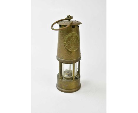 A vintage brass miner's lamp, 'The Protector Lamp &amp; Lighting Co, Eccles, Manchester', type 6 M&amp;Q, height 23.5cm.