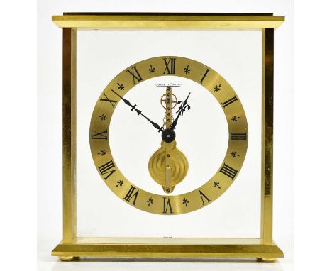 JAEGER-LECOULTRE; a gilt metal cased skeleton clock, the chapter ring set with Roman numerals, height 16.5cm, width 15.5cm.Co