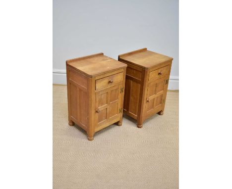 ALBERT 'EAGLEMAN' JEFFRAY; a pair of light oak bedside cupboard, each with a drawer and cupboard door, carved eagle motif, he