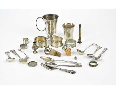 A group of Dutch small silver, including cup and napkin ring, also several white metal examples, caddy spoon, further spoons,