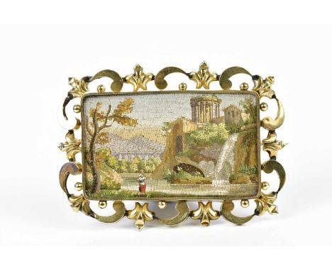 A good and large 19th century Italian micro mosaic brooch with pierced yellow metal frame and central panel depicting an Ital