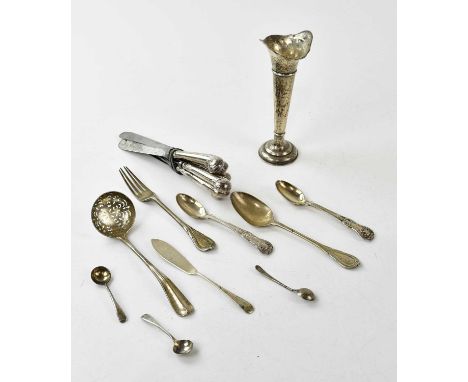 A collection of hallmarked silver items to include, spoons, fork, ladle, hallmarked silver handled knives and a weighted posy