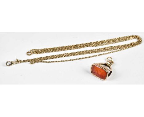 A Victorian yellow metal seal, with engraved initials WM, suspended on a 9ct curb link belcher chain, length 79cm, approximat
