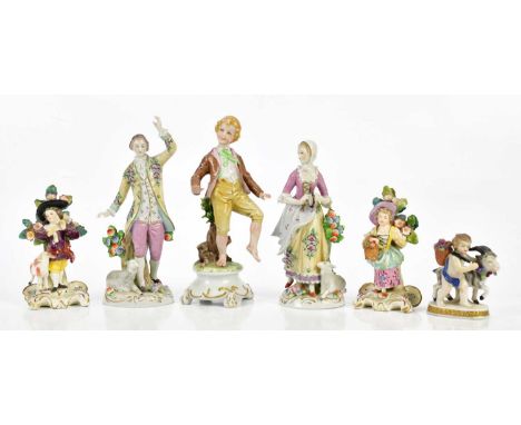 SITZENDORF; a pair of Continental porcelain figures of a gentleman beside a sheep and a maiden, height 17cm, and four further