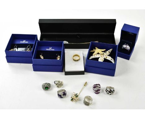 SWAROVSKI; a quantity of jewellery including seven sterling silver and crystal rings, two sets of earrings and two starfish b