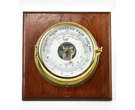 SCHATZ; a contemporary modern ship's style barometer mounted on a wooden plinth, overall 24 x 24cm.