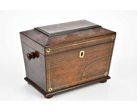 A 19th century rosewood tea caddy with mother of pearl inlay, the hinged cover enclosing two compartments, width 21cm.