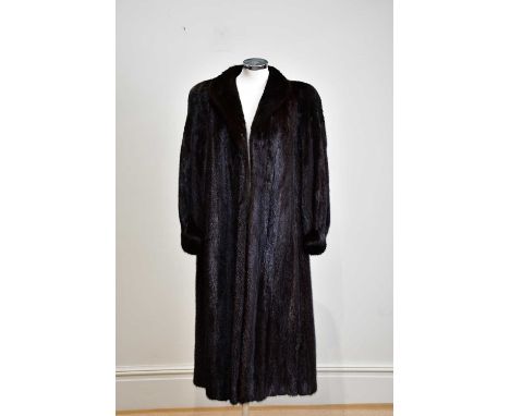 A vintage full length dark brown mink coat fully lined, measures 44” across chest. Condition Report: The full length mink coa