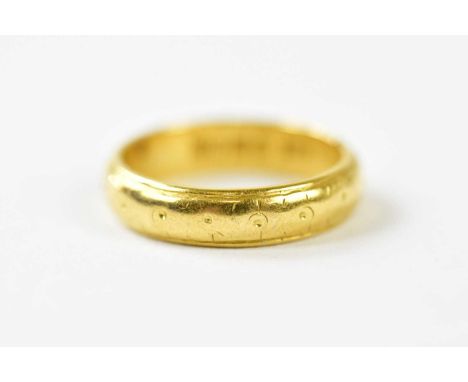 A 22ct yellow gold wedding band, size K, approx. 5.55g. 