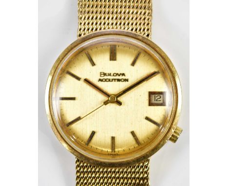 BULOVA; a gentleman's 9ct gold cased wristwatch, the dial set with batons and subsidiary date aperture, diameter excluding wi