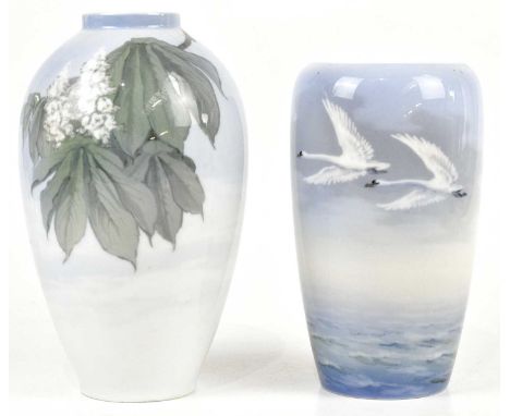 ROYAL COPENHAGEN; two ceramic vases including an example decorated with swans in flight, height 19cm (2).Condition Report: Li