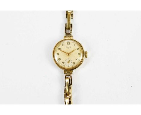 LIMIT; a vintage 9ct yellow gold wristwatch with Arabic numerals to the circular dial and sprung bracelet, total approx 16.58