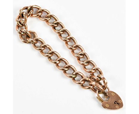 A 9ct rose gold hollow curb link bracelet with padlock and safety chain, approx. 15.85g. 