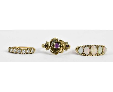 A 9ct yellow gold five stone opal ring, size P (one opal badly damaged), a 9ct yellow gold half eternity ring, combined appro